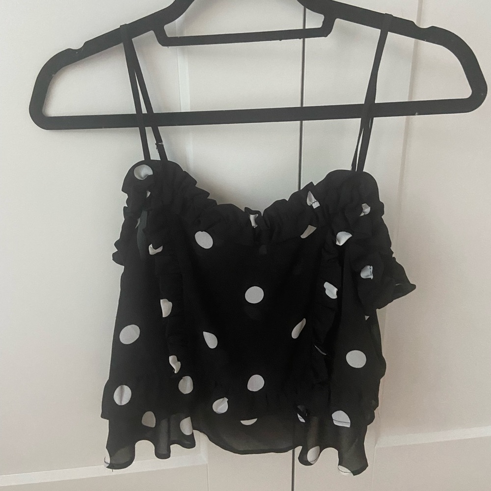 Flowy silky top with subtle ruffles and polka dots